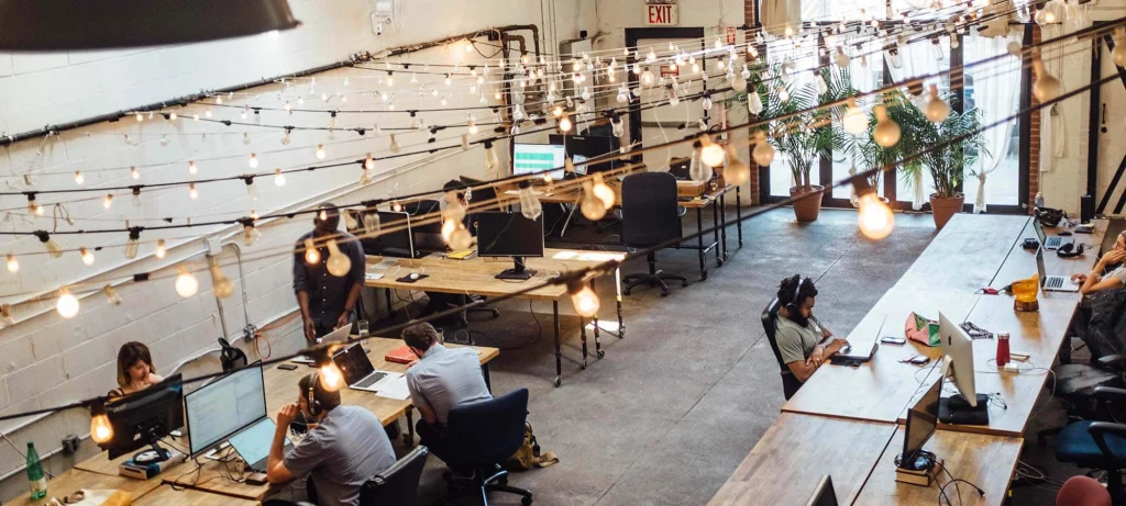 open plan office layout with employees working at their desks