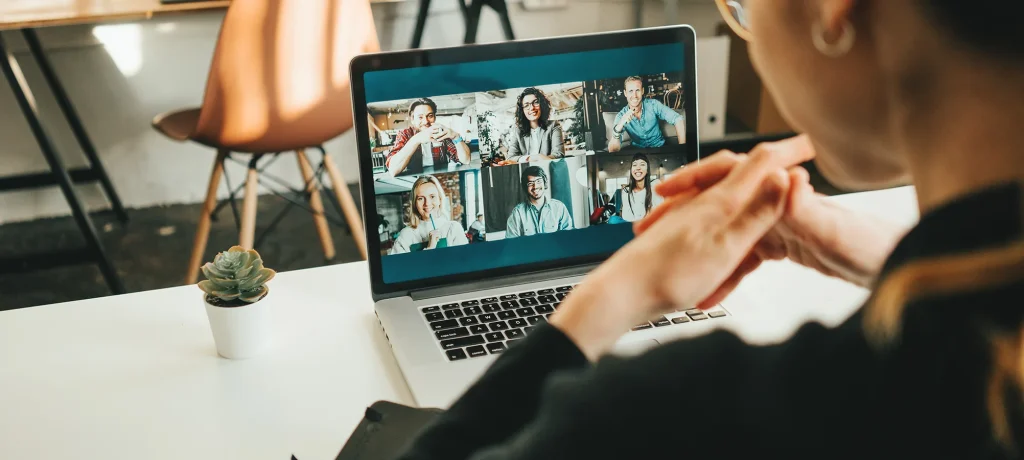 woman working from home on a video call with colleagues