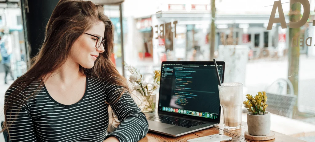 woman in a cafe performing agile working