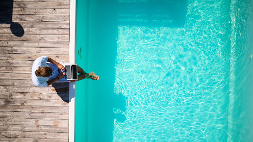 unlimited time off, relaxing by a pool