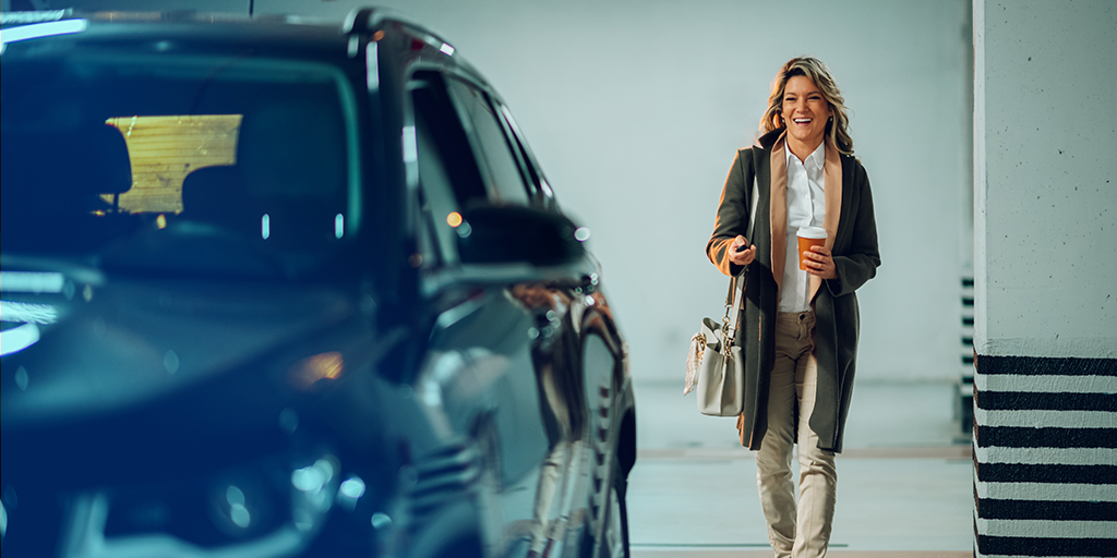 Office professional walking to their car in a car park