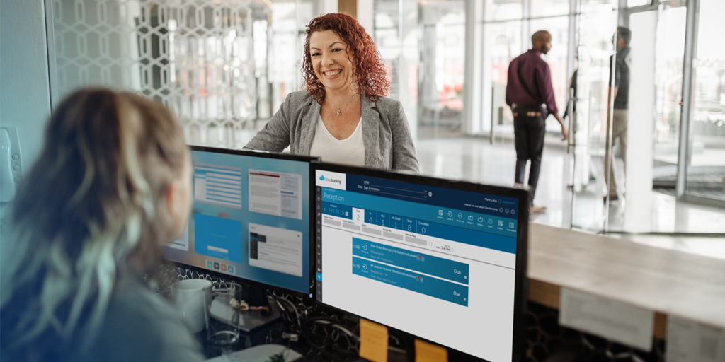 Reception using Cloudbooking to check in a visitor